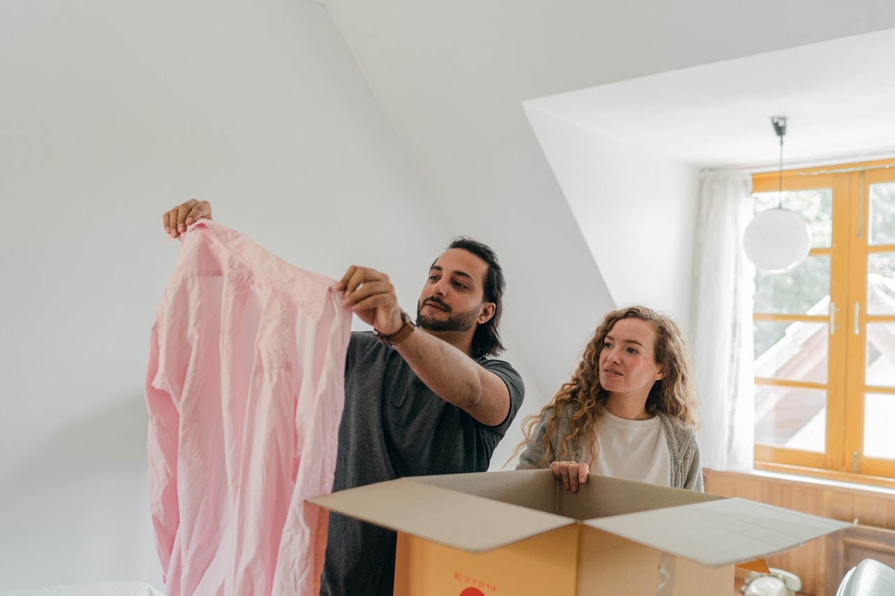 A couple deciding what to pack for moving from Delaware to Florida