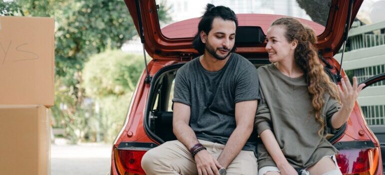 A young couple talking while unpacking