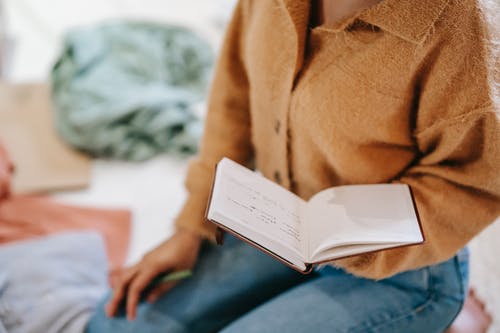 a woman holding a notebook