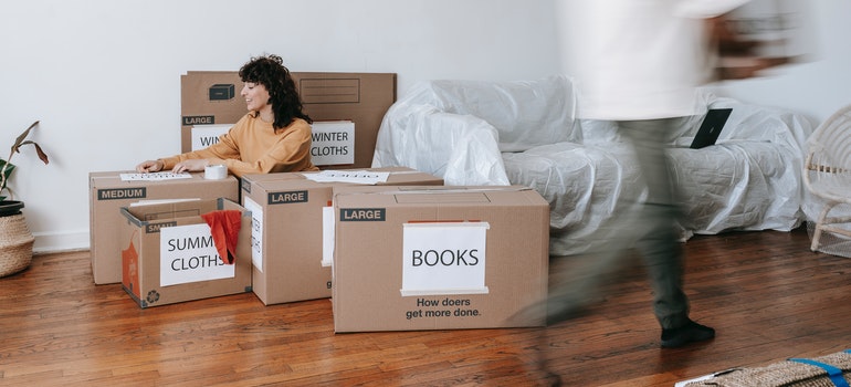 Couple packing between boxes