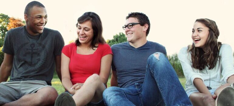 friends hanging out in a park