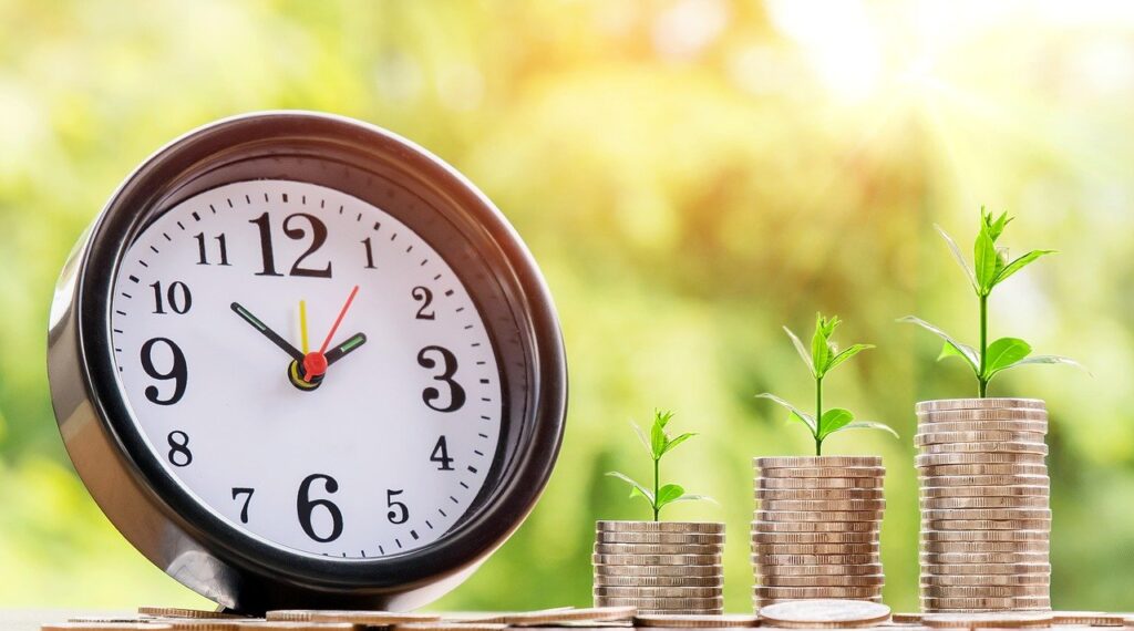 A clock and stacks of coins