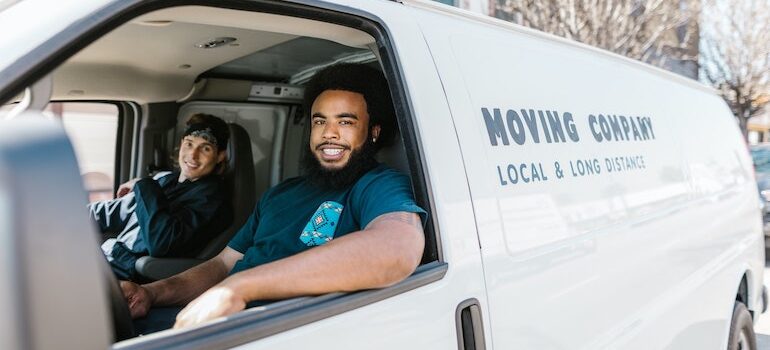 two men in a moving van 