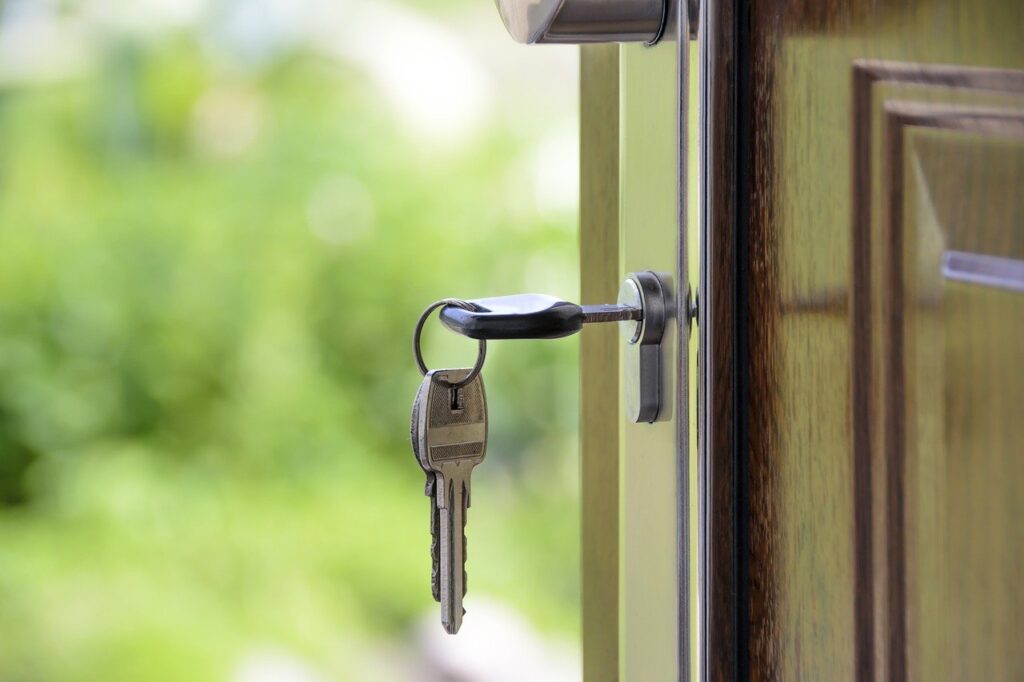 A key in a keyhole of a wooden door