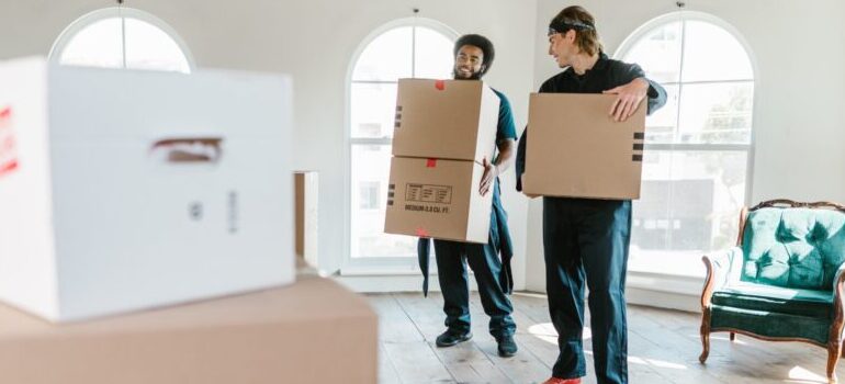 movers carrying boxes