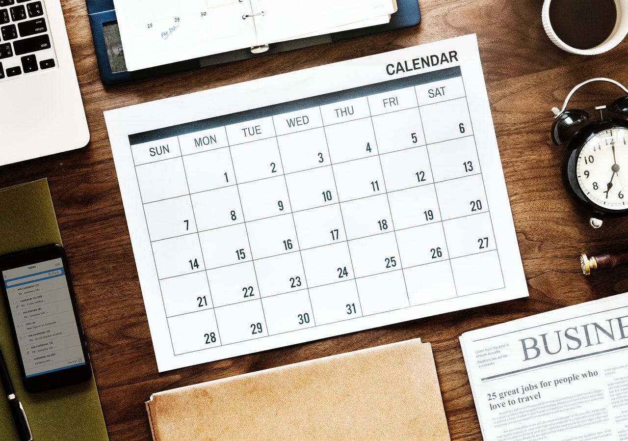 A calendar on a wooden table