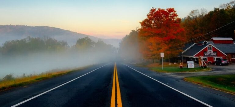 Moving from Texas to Massachusetts - a country road clouded by fog