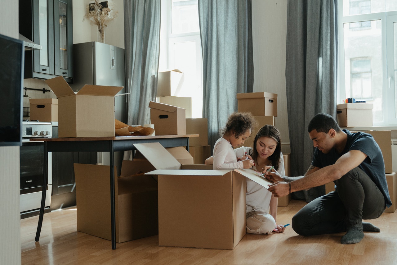 A family packing their belongings