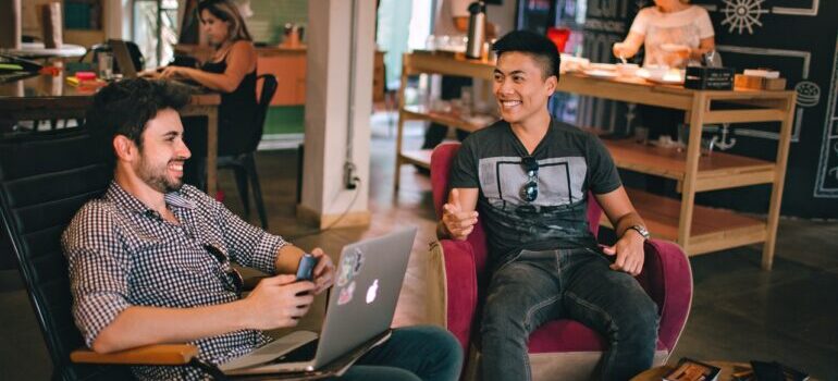 Young entrepreneurs having fun in a coffe shop.