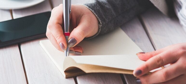 A woman writing a list