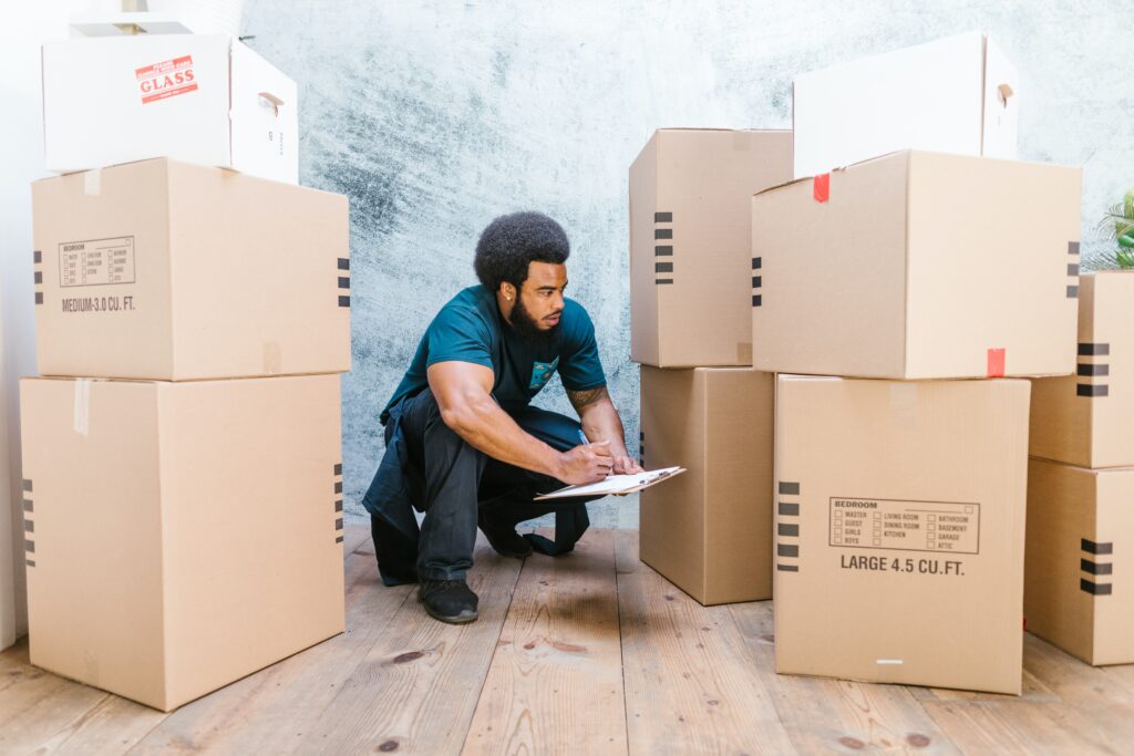 a moving expert looking at boxes