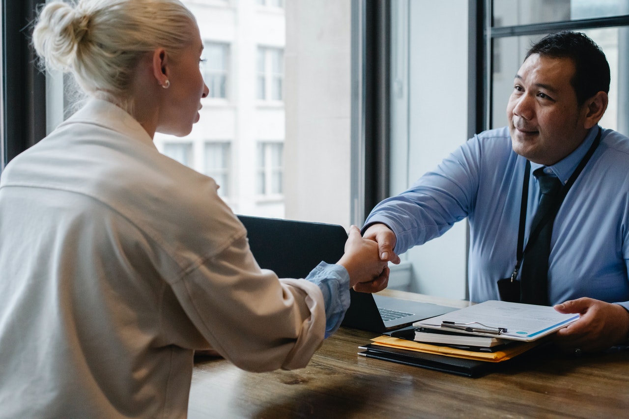 A man and a woman shaking hands