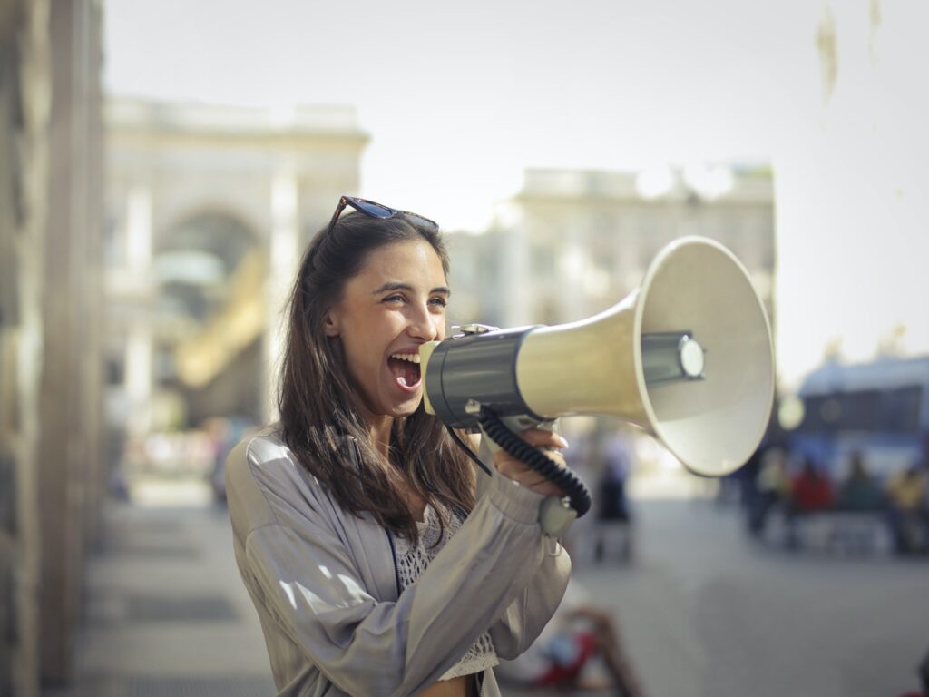 woman shouting through a megaphone