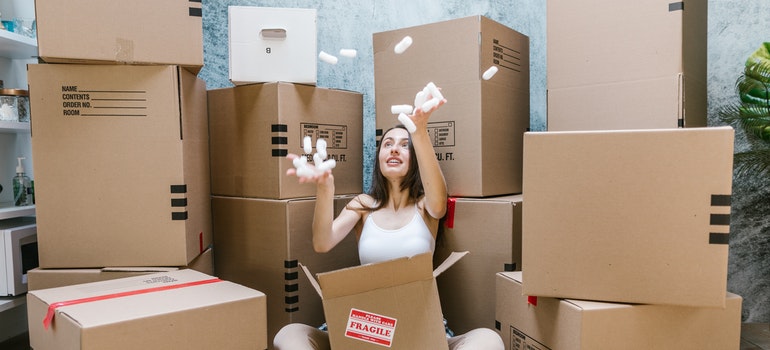 A girl surrounded by boxes
