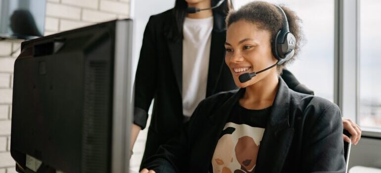 A woman who works in customer care at a moving company.