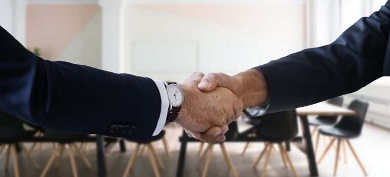 A handshake between two people.