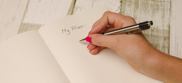 person writing a plan