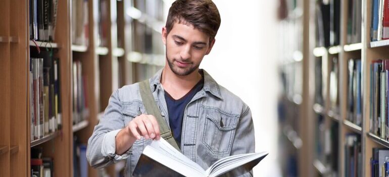 A college student reading a book.