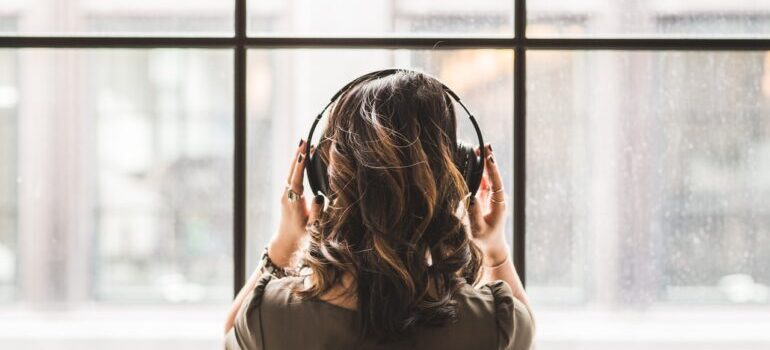 The girl is listening to music.