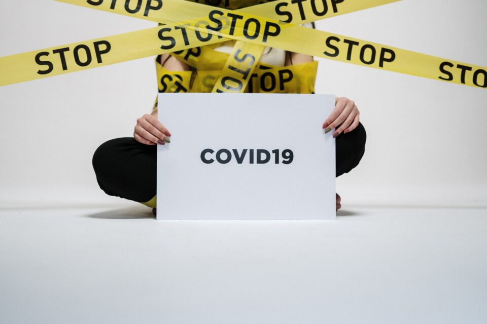 person holding a COVID19 sign