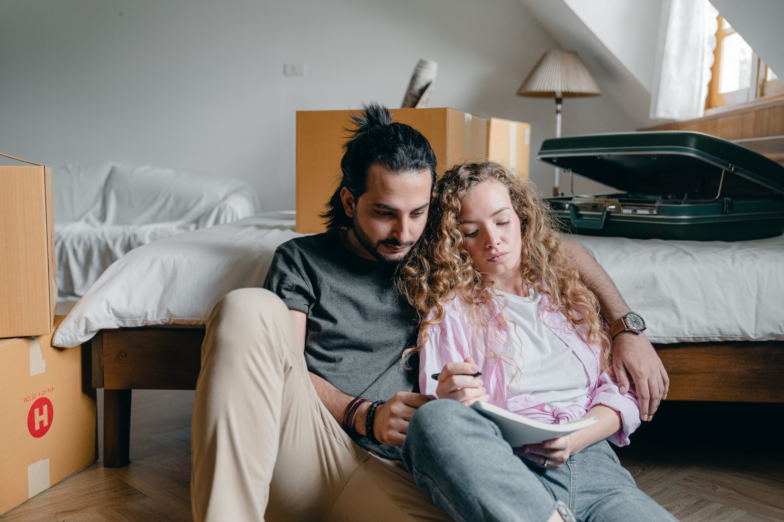 a couple preparing a moving plan for a DIY move