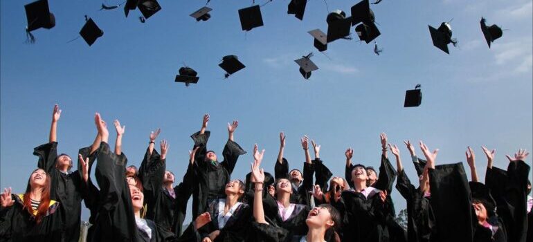 Graduates throwing their hats