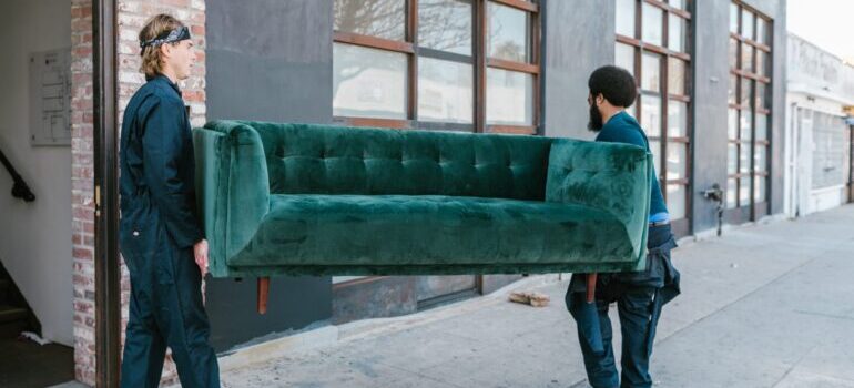 Movers carrying a couch