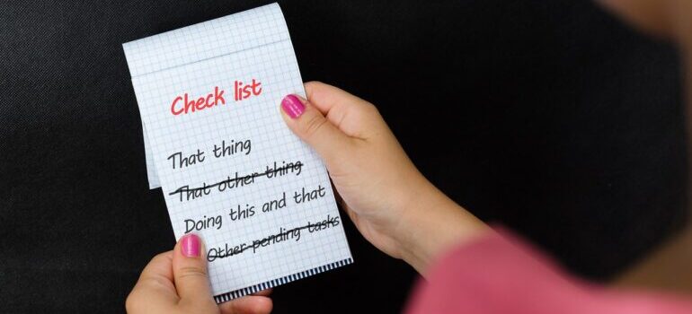 A woman holding a checklist.