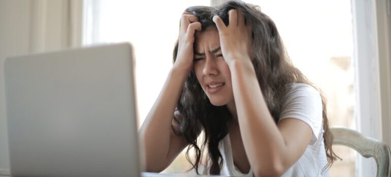 A woman stressing out during a move because she didnt hire one of the top movers in San Antonio to help her out.