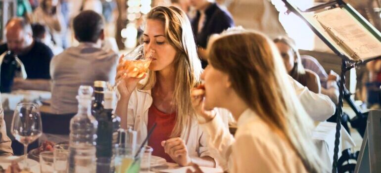 Two friends having dinner.