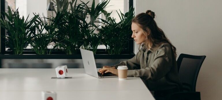 A woman researching movers on her laptop.