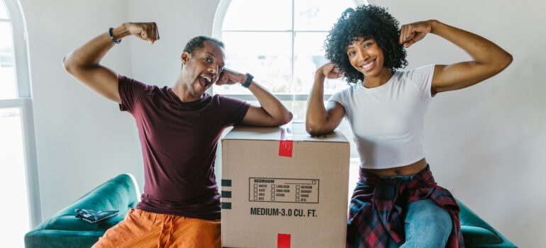 A woman and one of the top movers in San Jose flexing together.