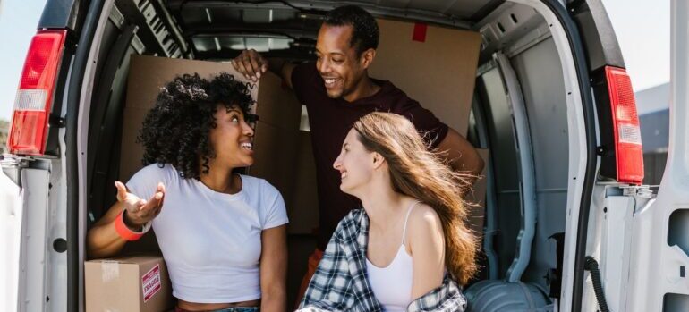 A mover socializing with clients during a move.