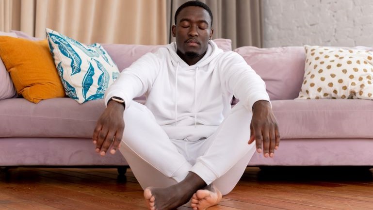A man meditating.