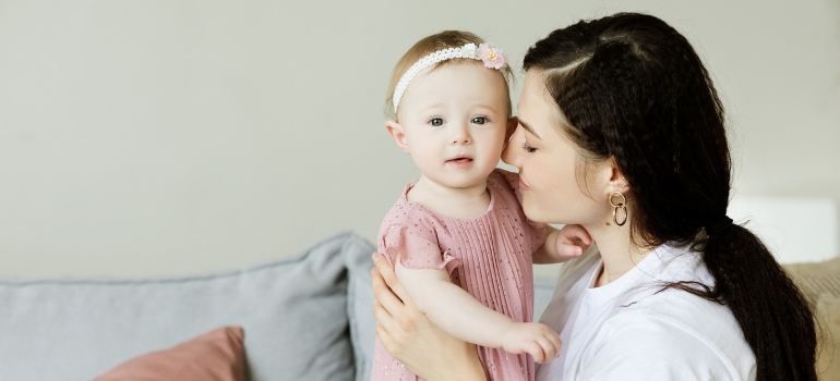 A mother holding a child.