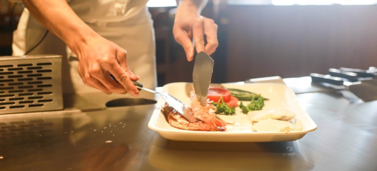 A chef preparing a dish in a restaurant.