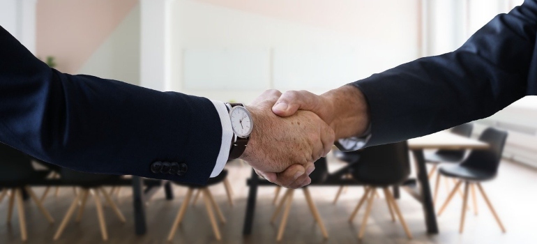 Two people shaking hands.