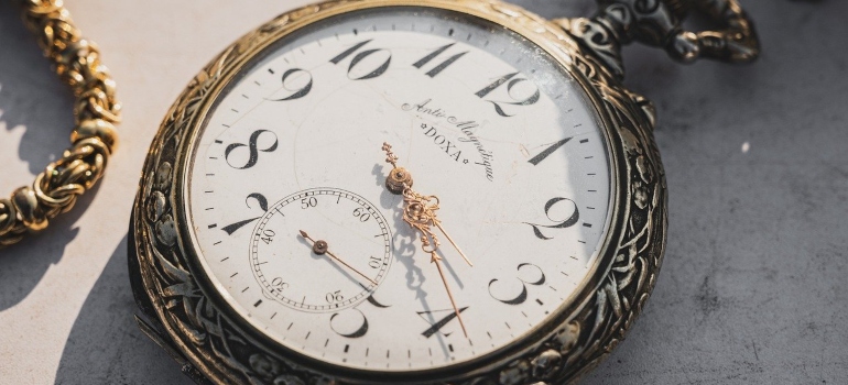 A close up of a pocket watch.