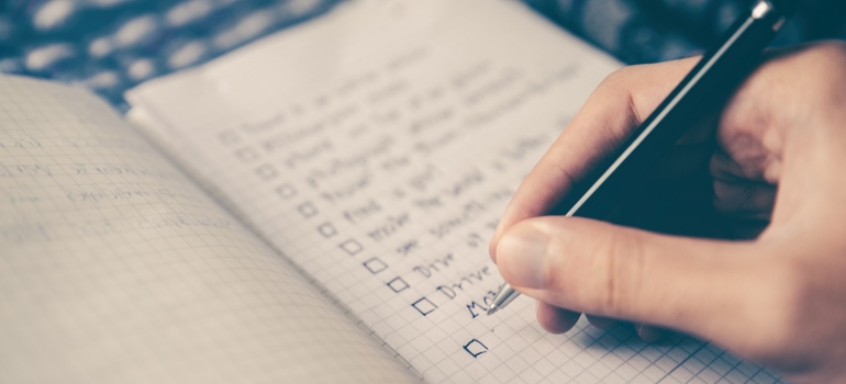 A person creating a checklist.