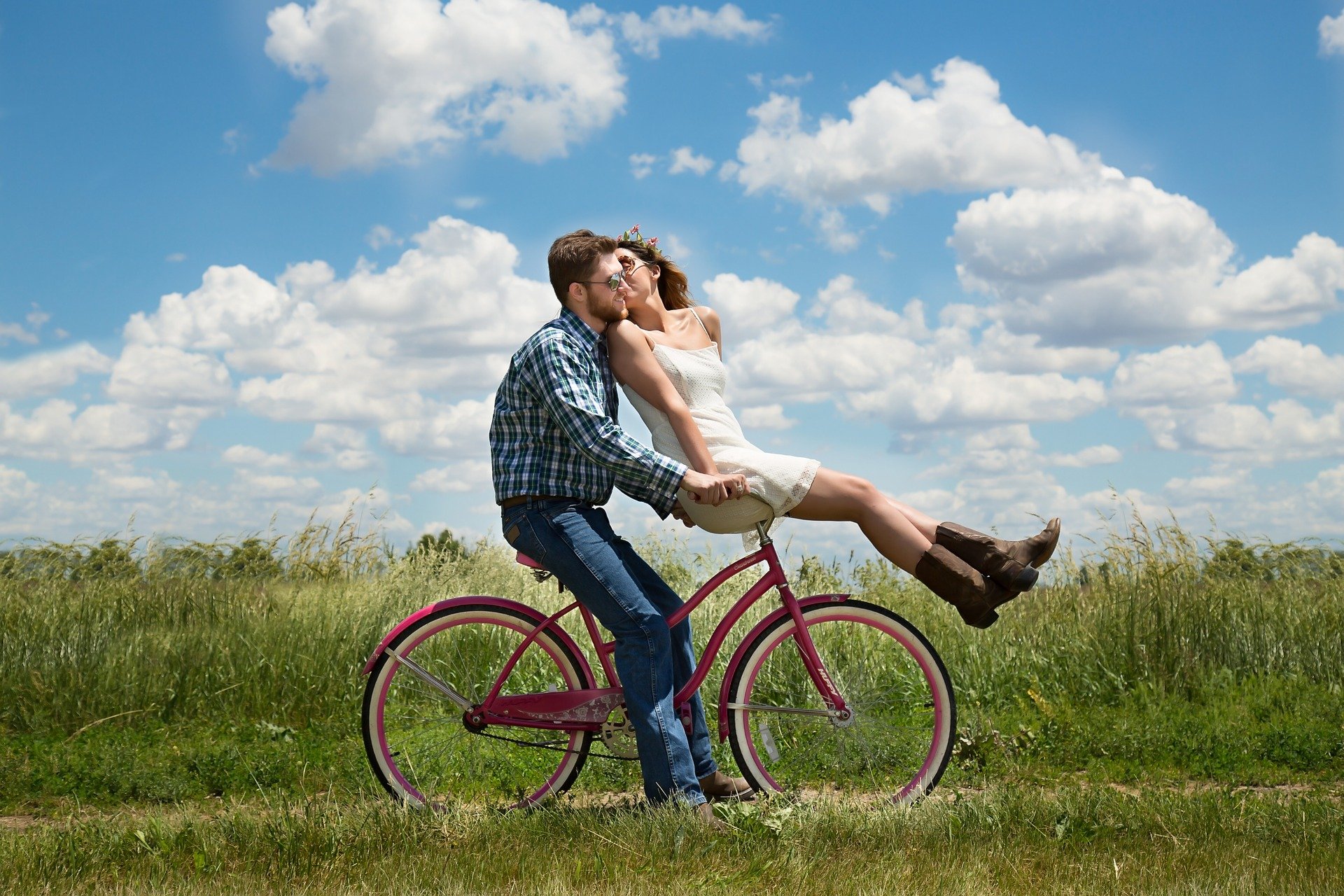 happy couple riding a bike