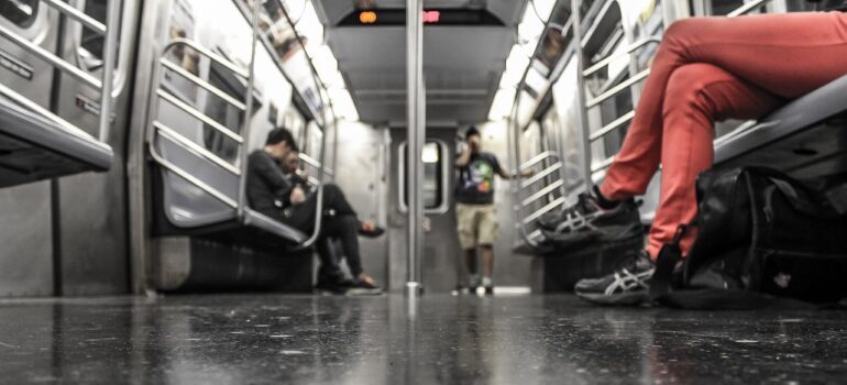 A picture of people on a subway.