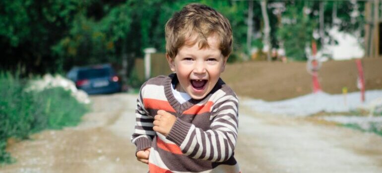 A little boy running.