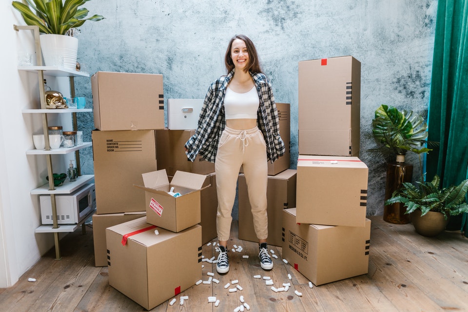young woman surrounded by boxes
