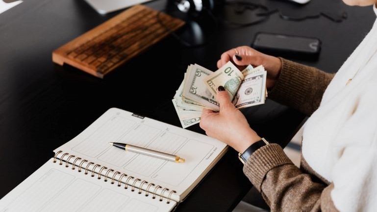 A woman counting money.