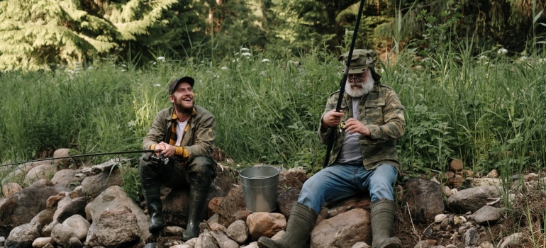 two men fishing as an example on how to have fun after moving to Cleveland