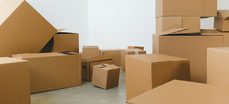 find moving boxes scattered over the floor 