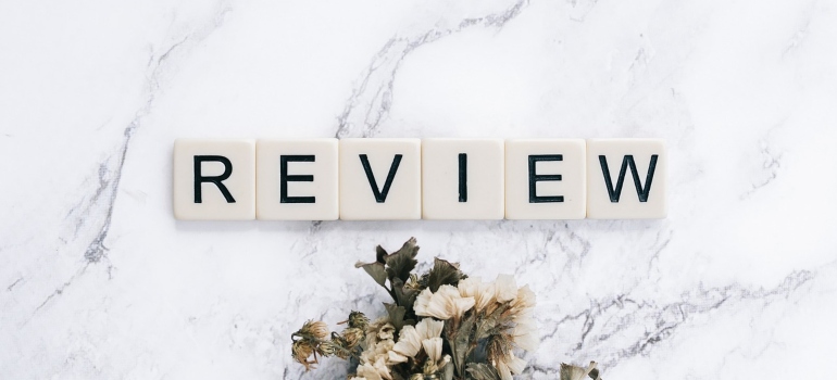 The word review on a marble countertop.