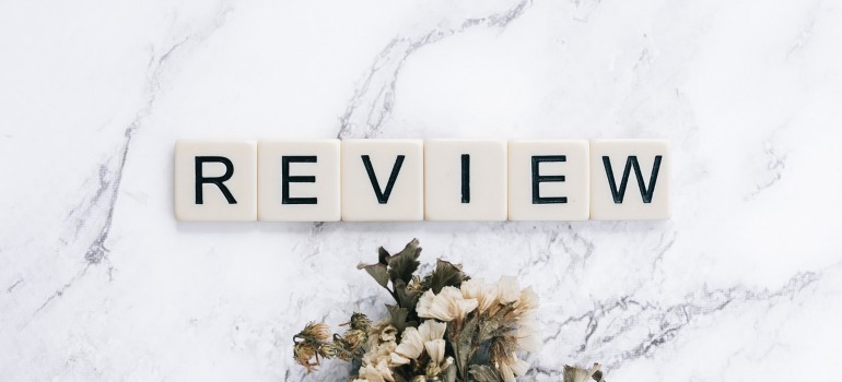 The word review on a marble surface.