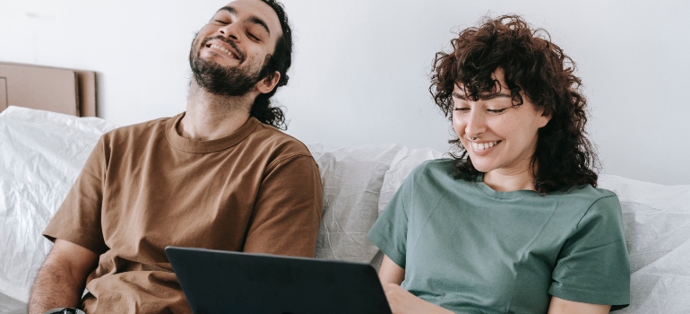 happy couple looking for popular cities to move to in 2022 