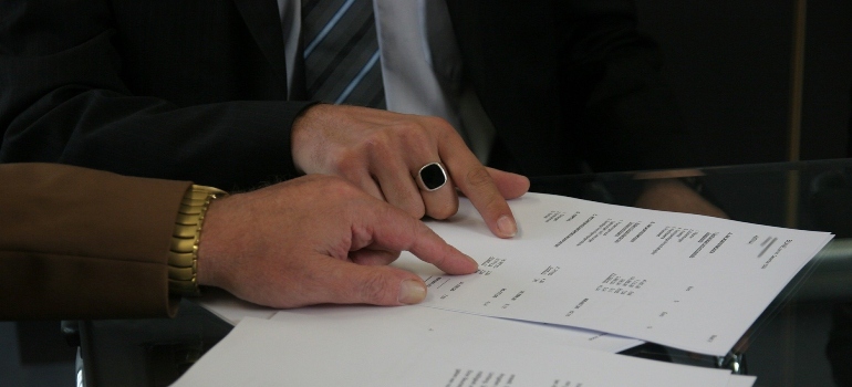 two people checking a contract